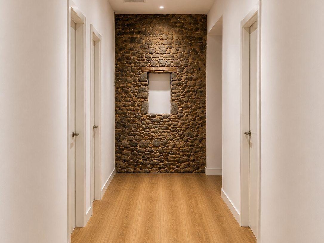 Pasillo con pared de piedra vista, render final